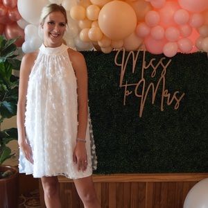 White mini dress with floral appliqués